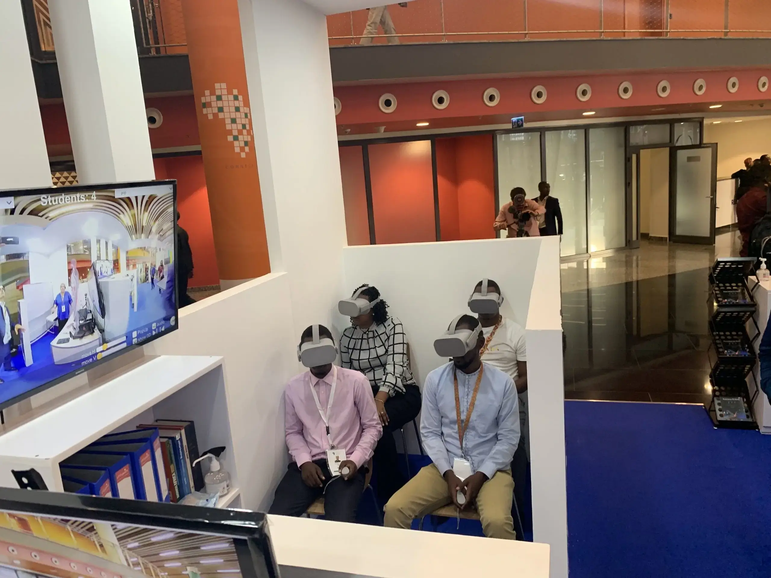 Group of 4 people with Vr headsets in a small room
