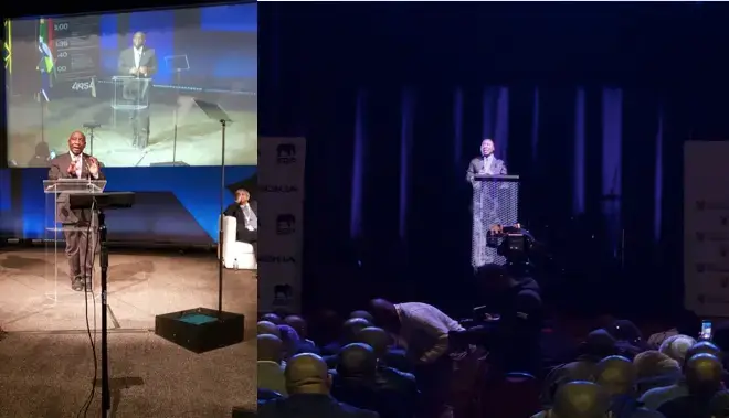 South african president talking on a podium and being streamed as a hologram for a crowd in an other location
