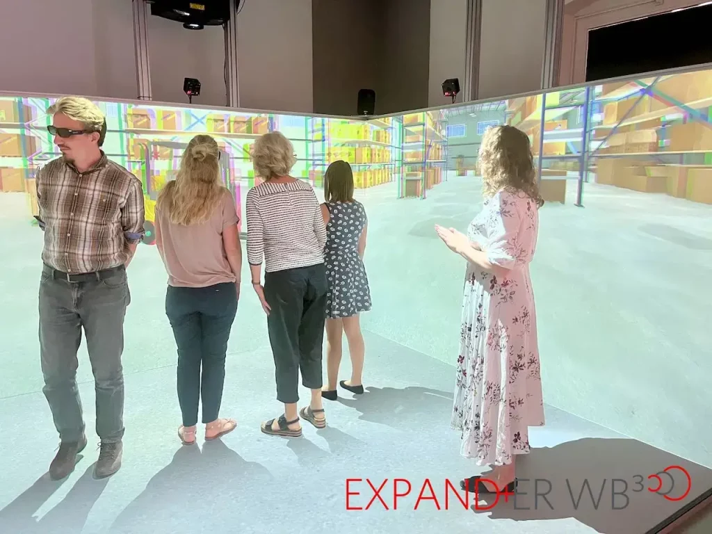 5 people exploring the expander wb-cave virtual room