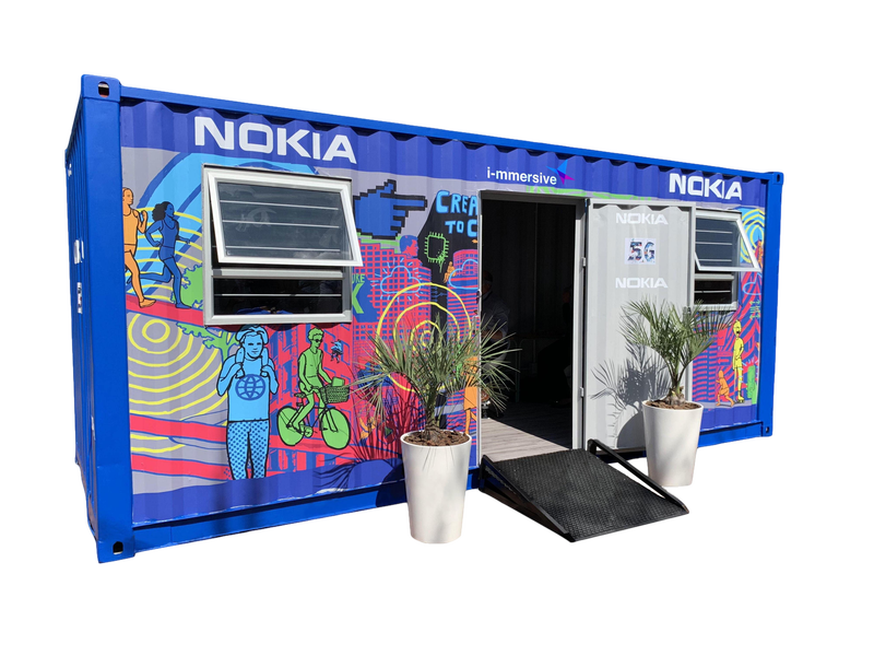 A rebuilt blue container with houses vr technologies for connected schools